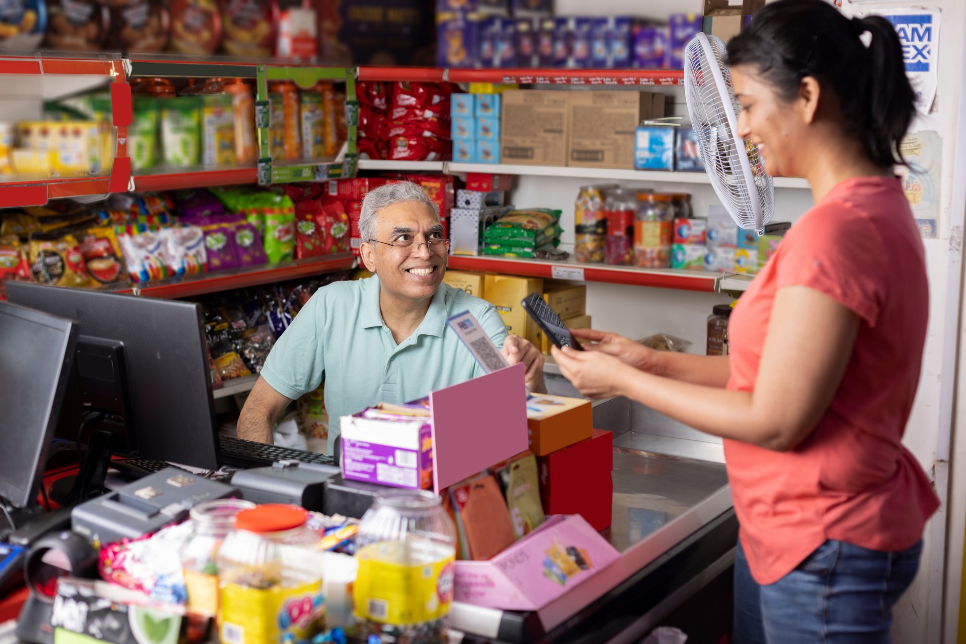 Woman paying by credit card at the supermarket